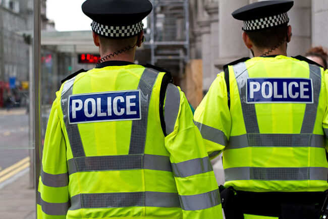 two Police men walking the streets
